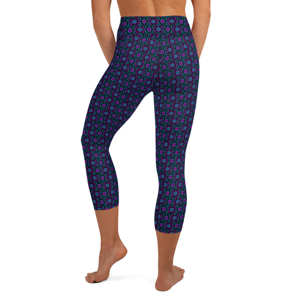 Back view of Purple Playmaker Pickleball Yoga Capri Leggings on a model, highlighting the snug high-waist and colorful purple and magenta design. Perfect for sports and fitness activities with a touch of style.