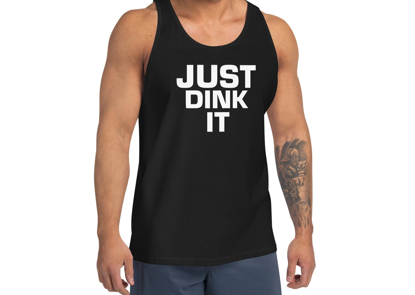 Model wearing a black JUST DINK IT tank top from OOKAMI SPORTS, showing the bold front graphic.