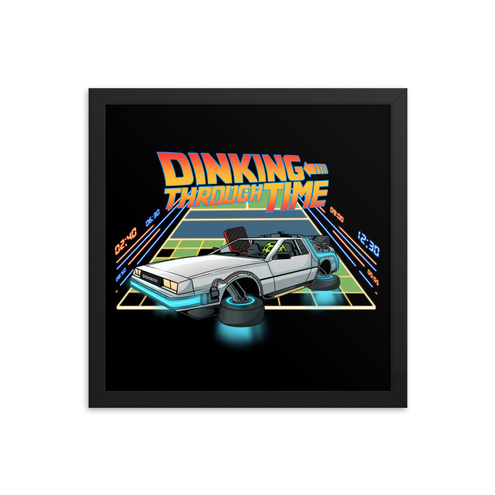 Framed poster depicting a futuristic pickleball car inspired by a DeLorean, with the words 'Dinking Through Time', in a 14x14 black frame.