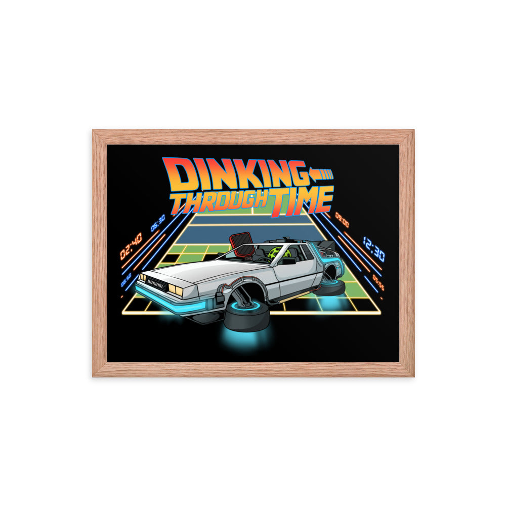 Framed poster of a DeLorean with the text 'Dinking Through Time' in a red oak frame, size 12x16 inches.