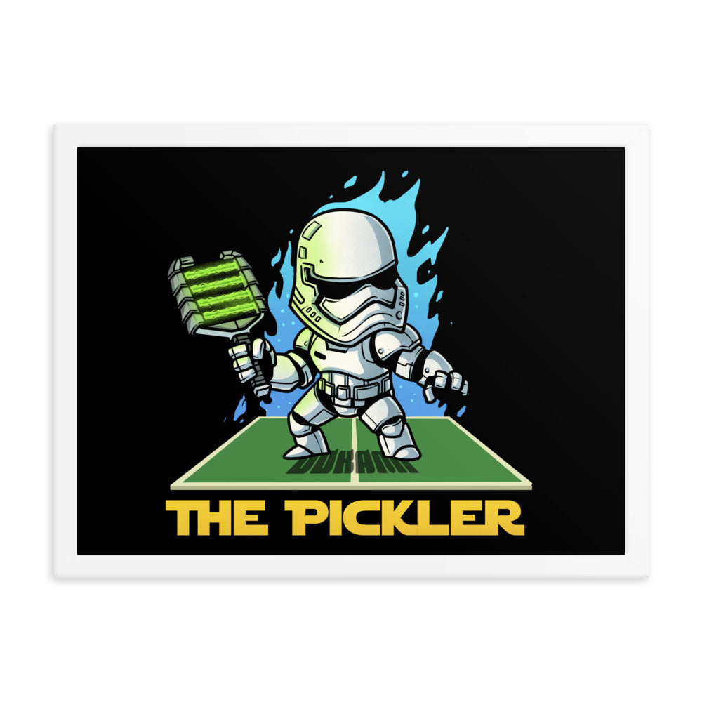 (18x24 inches): "A medium-sized framed poster featuring a stormtrooper-inspired character called 'The Pickler', holding a green pickleball paddle. The artwork includes vibrant blue flame effects on a black background, encased in a white frame.