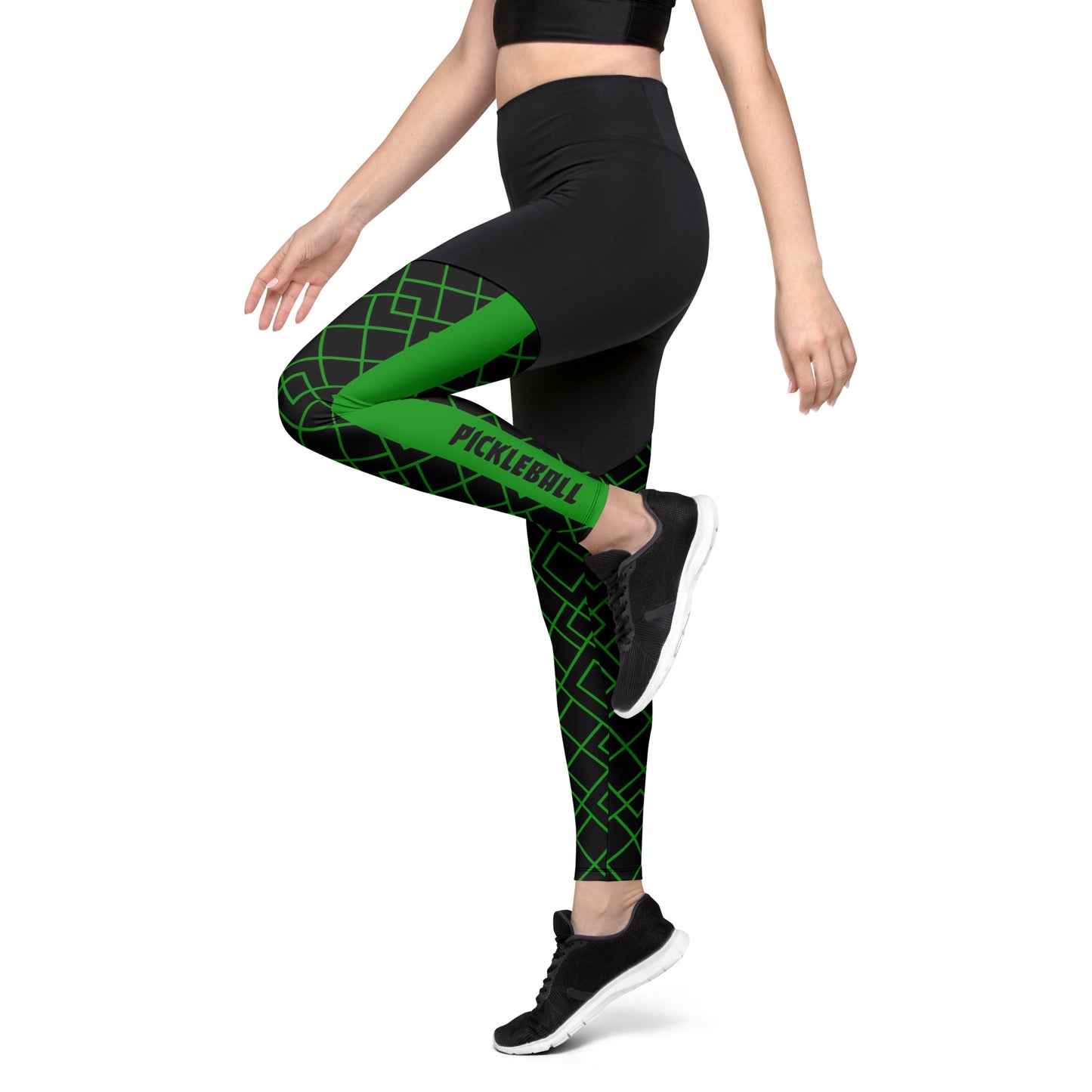 Side view of a woman wearing Neon Grid Pickleball Sports Leggings, showing the bold green and black grid pattern with the word "Pickleball" on the lower leg.