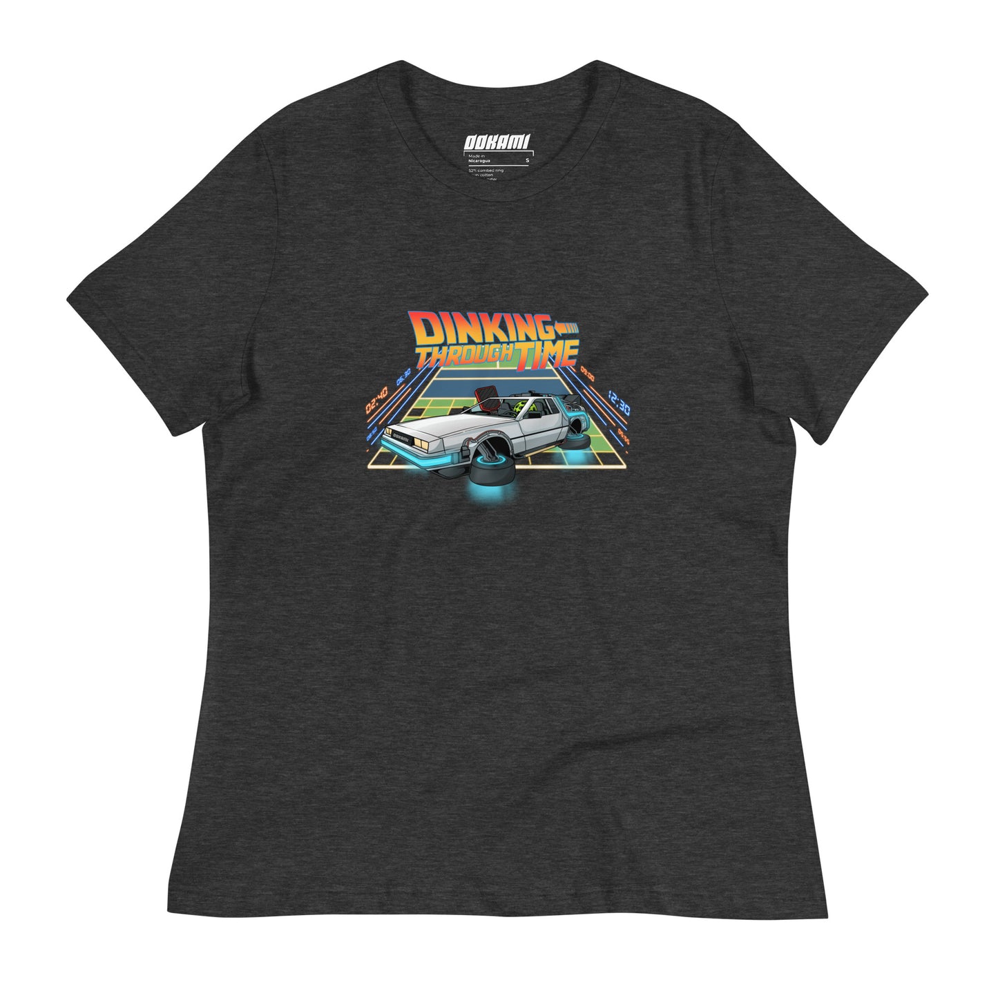 Front view of a dark grey heather women's relaxed t-shirt featuring a colorful 'Dinking Through Time' pickleball design with a time-travel theme.