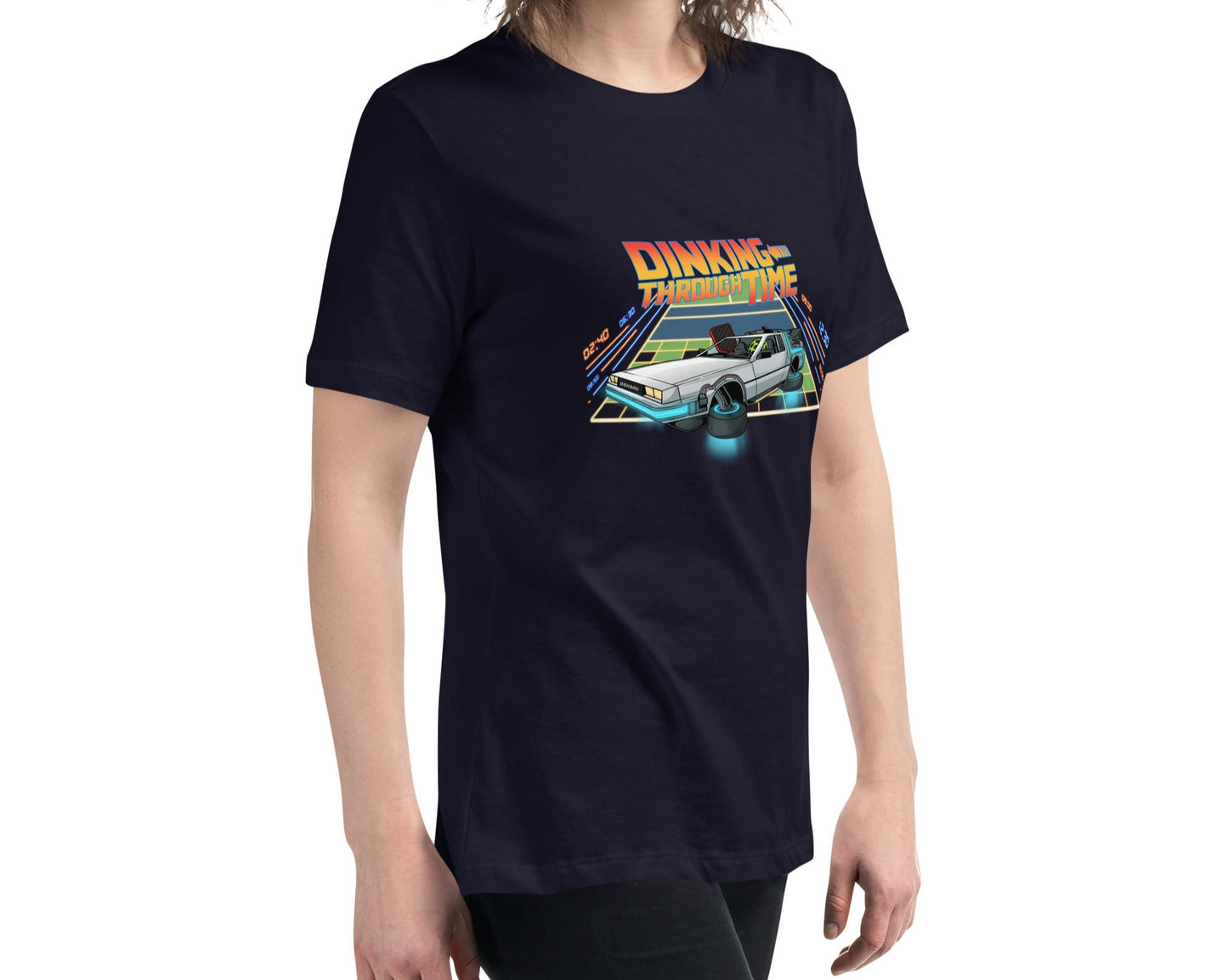 Front angled view of a navy women's relaxed t-shirt with the 'Dinking Through Time' pickleball design, emphasizing the design and style.