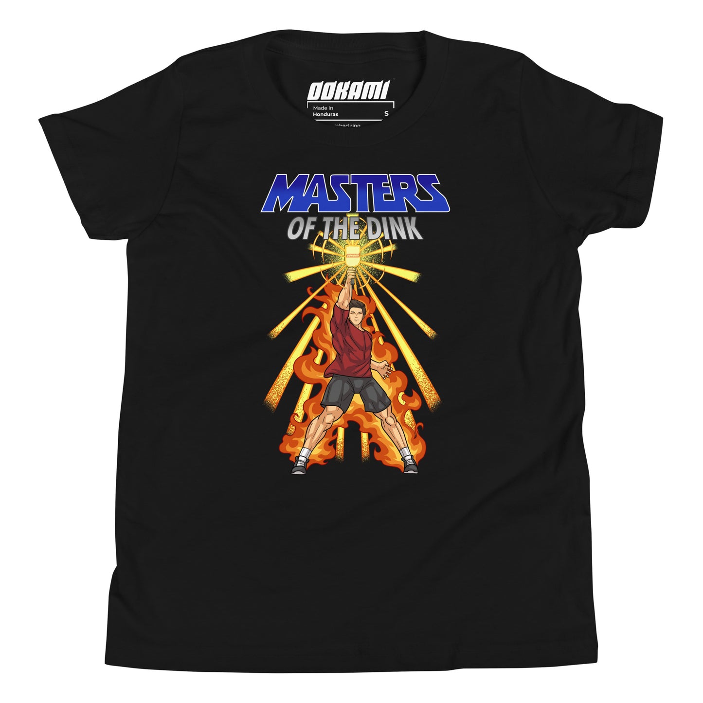 Youth size black t-shirt featuring a dynamic design inspired by He-Man and The Masters Of The Universe, showcasing a fierce pickleball player with a paddle, surrounded by flames and radiating energy