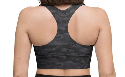 Back view of a woman wearing the Stealth Camo Pickleball Longline Sports Bra, showcasing the racerback design, longline cut, and camouflage pattern.