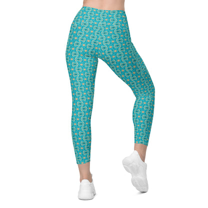 High-waisted leggings with an all-over turquoise geometric print, featuring convenient side pockets. Perfect for yoga, workouts, or casual pickleball games