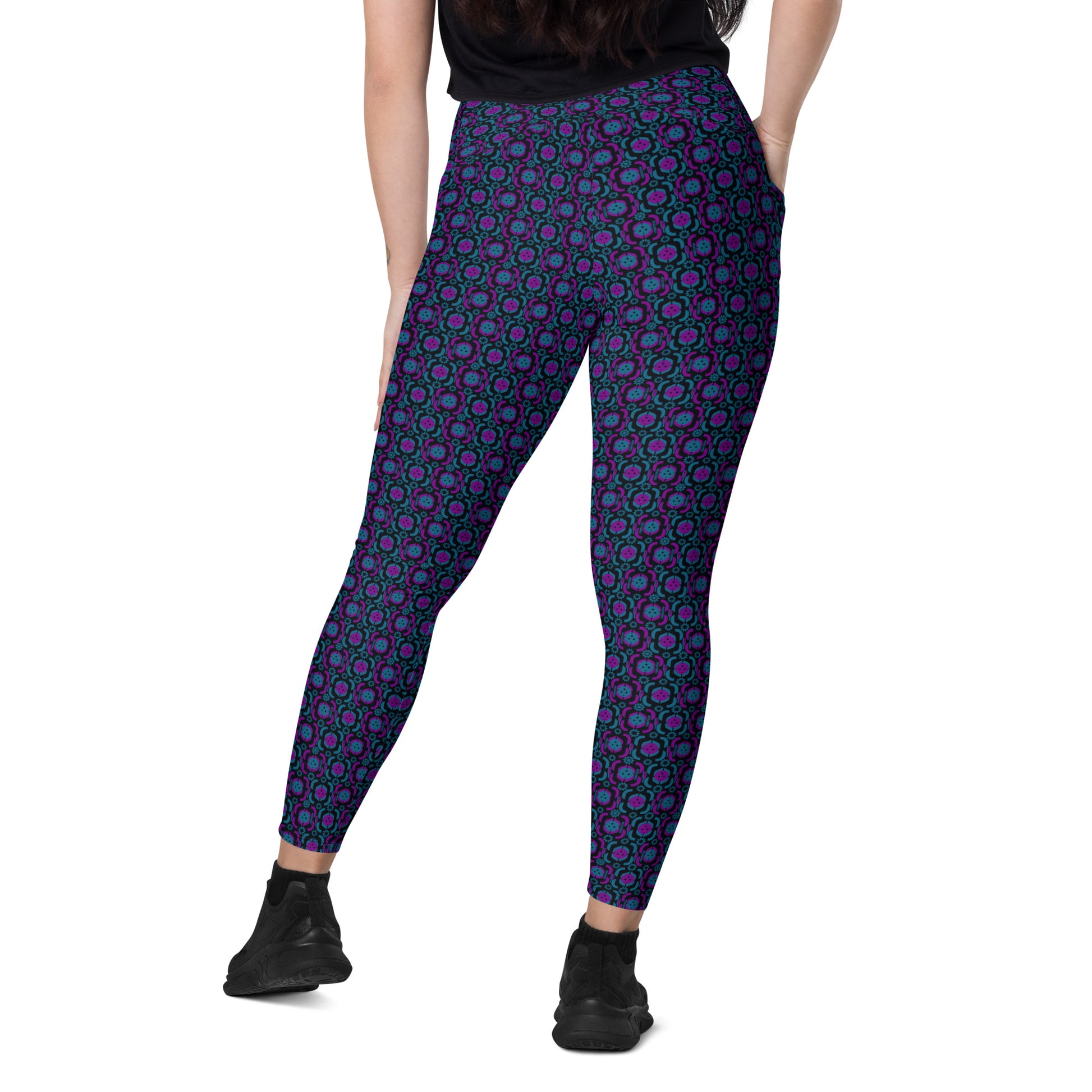 Rear view of high-waisted leggings showcasing a vibrant purple and blue pickleball-themed geometric pattern. Designed for active wear, these leggings provide comfort and style for pickleball enthusiasts