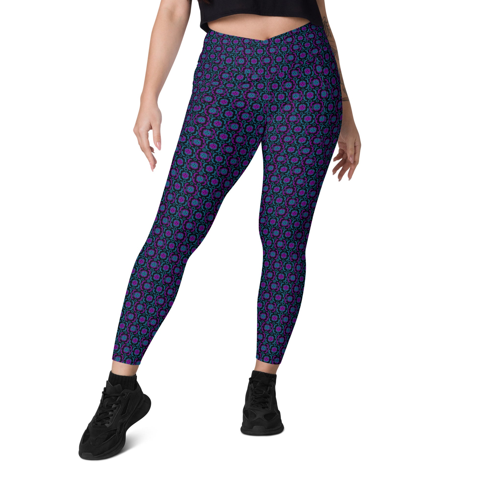  Front view of high-waisted pickleball leggings featuring a striking purple and blue geometric print. These leggings are designed for both style and comfort, making them perfect for pickleball games and everyday activities. 