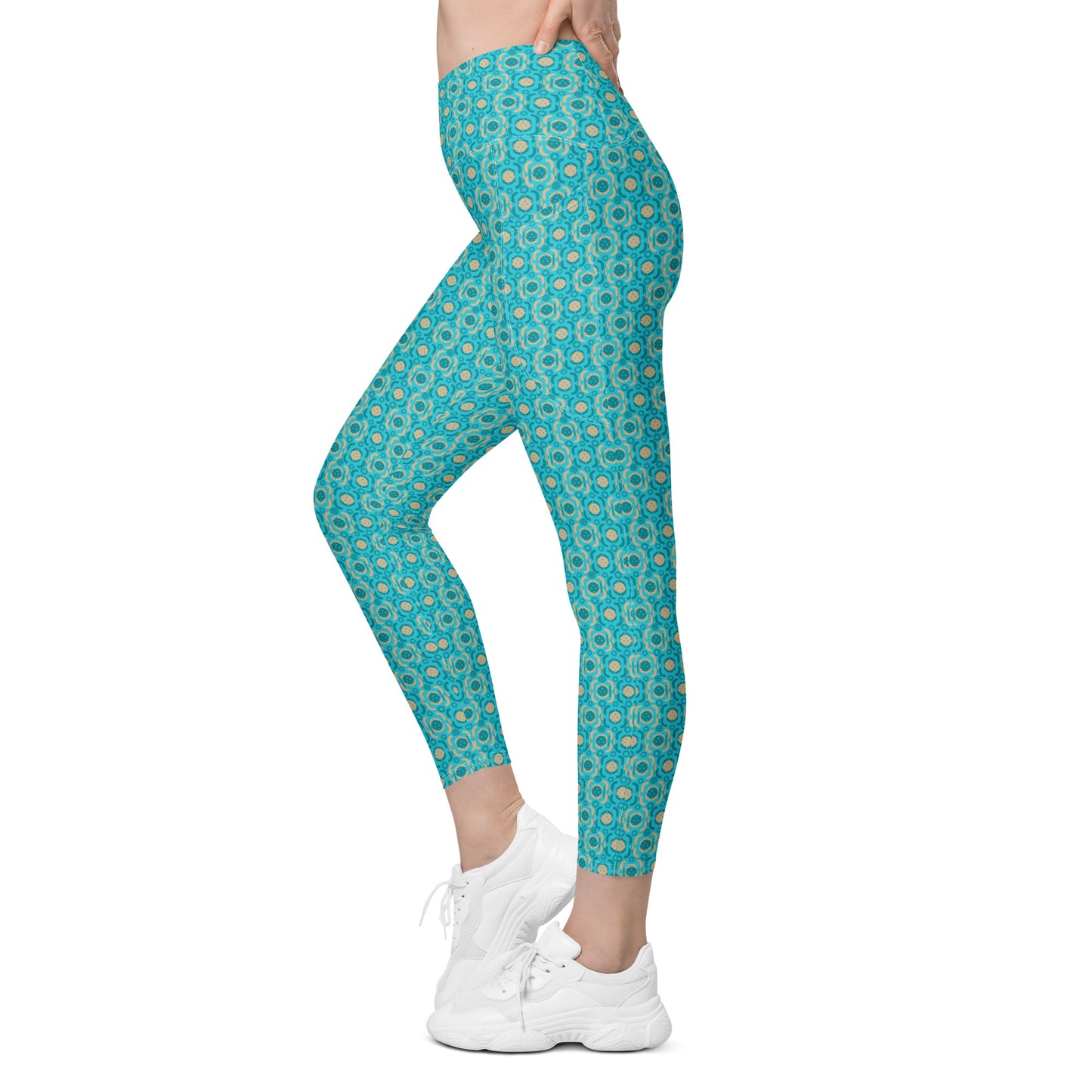Stylish and functional high-waisted leggings in a vibrant turquoise geometric print, shown from the left side. Ideal for fitness enthusiasts and pickleball players.