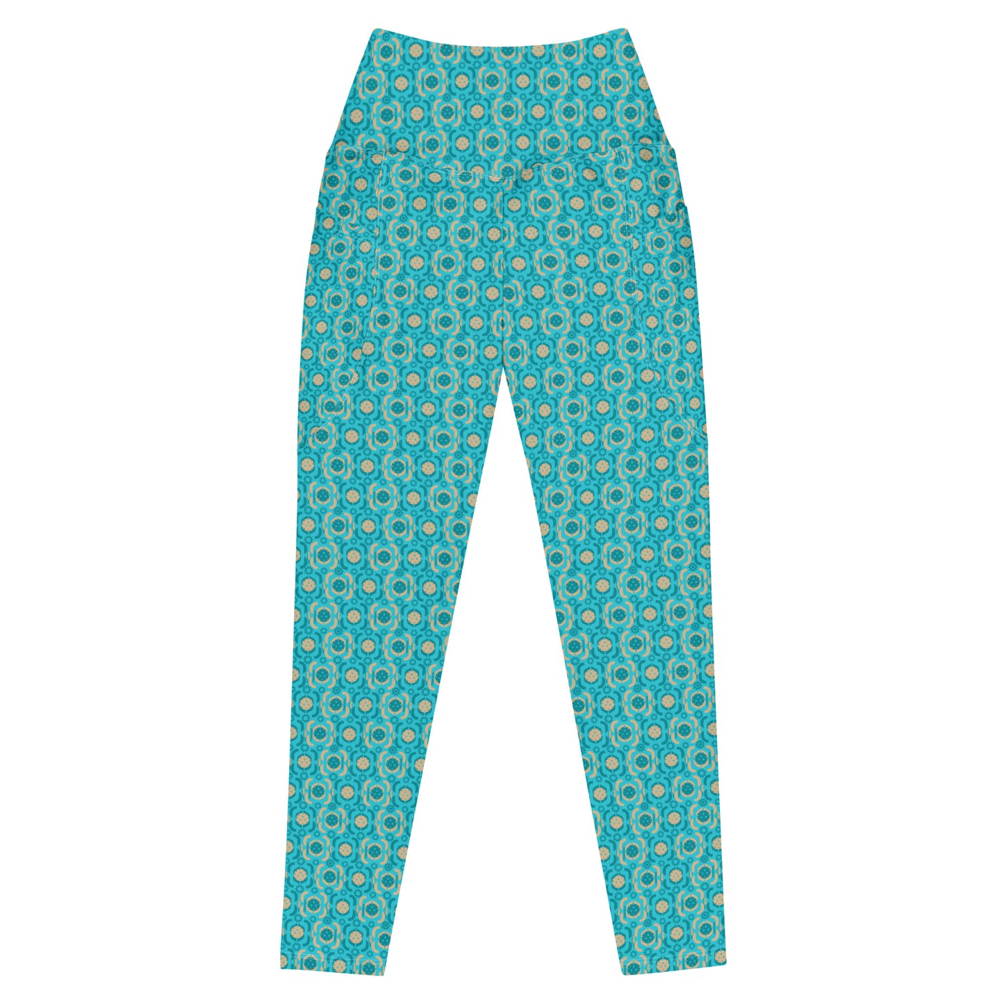 Close-up view of turquoise printed pickleball leggings emphasizing the detailed fabric pattern and comfortable, high-waisted design suitable for active wear.