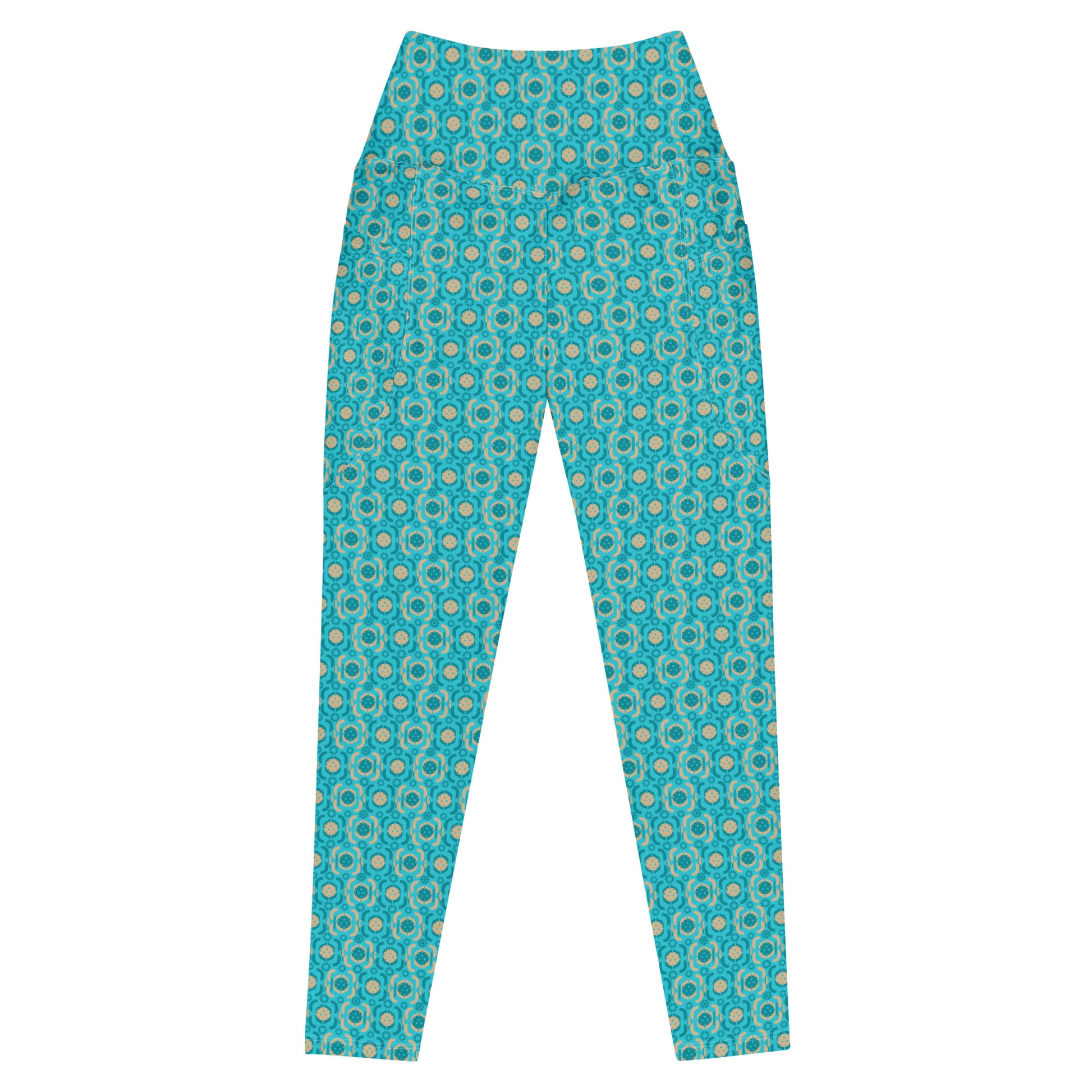 Close-up view of turquoise printed pickleball leggings emphasizing the detailed fabric pattern and comfortable, high-waisted design suitable for active wear.