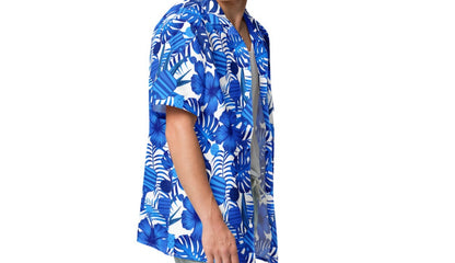 Model wearing the Tropical Blue Botanical Pickleball Lovers Oversized Button-Up Shirt, emphasizing the relaxed fit and vibrant blue floral design with pickleball paddles and balls.