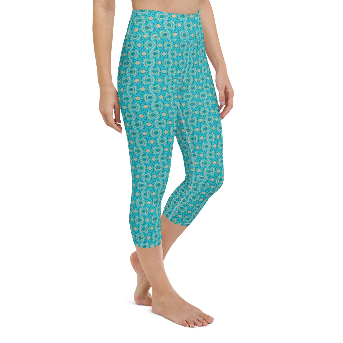 Turquoise Tranquility Pickleball Yoga Capri Leggings displayed on a model, featuring a vibrant turquoise hue with a detailed pickleball-themed print, offering a high-waisted fit that's ideal for active wear.