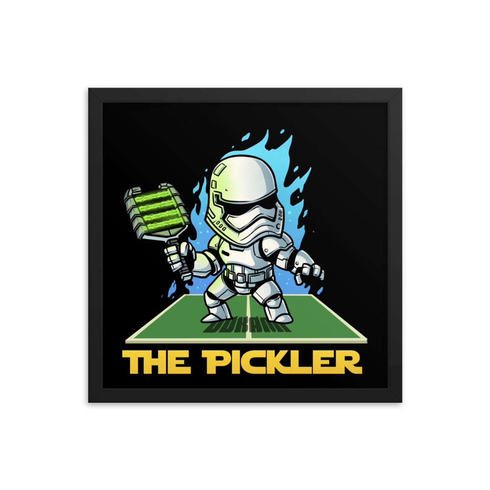 16x16 framed poster of 'The Pickler Stormtrooper' depicting a stormtrooper in pickleball gear, dynamically positioned on a pickleball court, within a black frame.