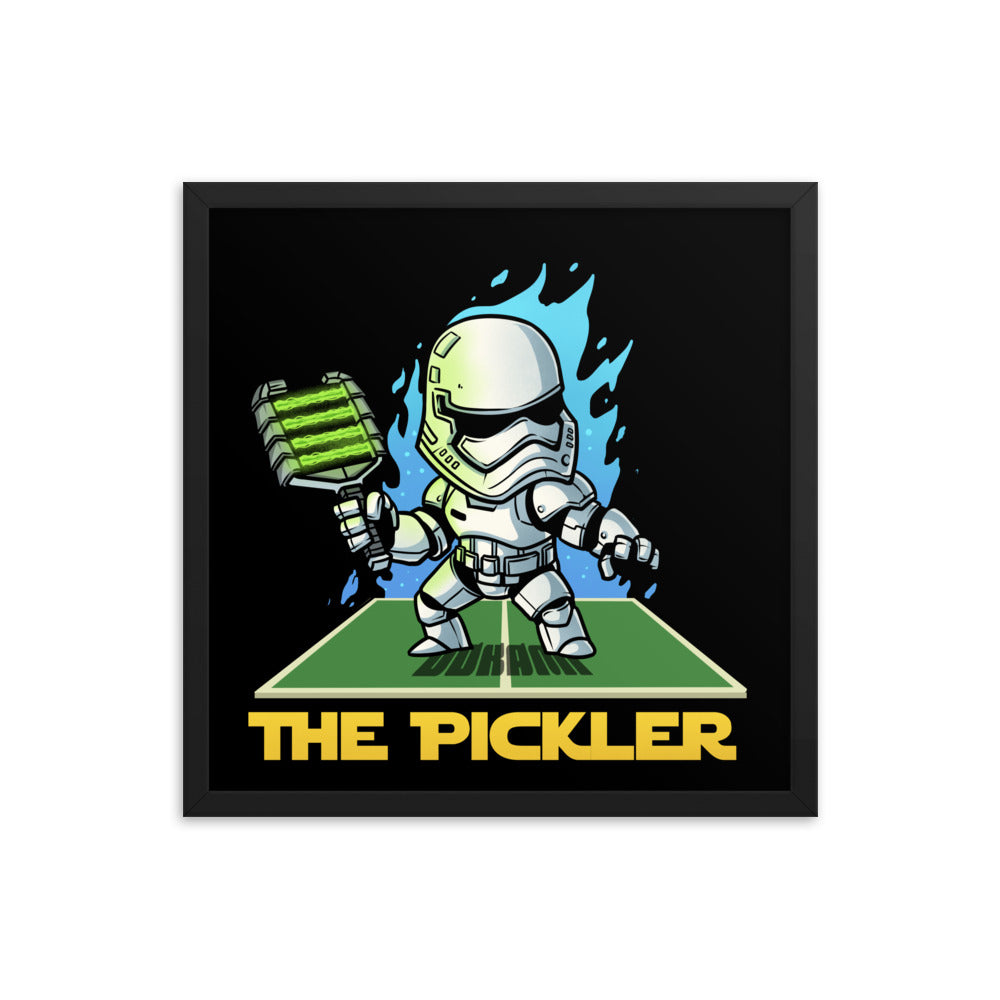 Large framed poster featuring 'The Pickler Stormtrooper' inspired by Star Wars, showcasing a stormtrooper styled pickleball player in action on a pickleball court, set within a sleek black frame.