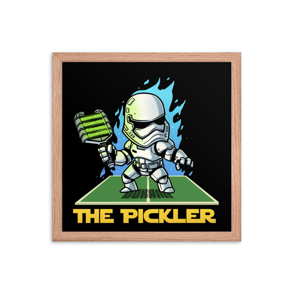 14x14 inch square framed poster of 'THE PICKLER', a playful depiction of a stormtrooper with a pickleball paddle, in a stark red oak frame.