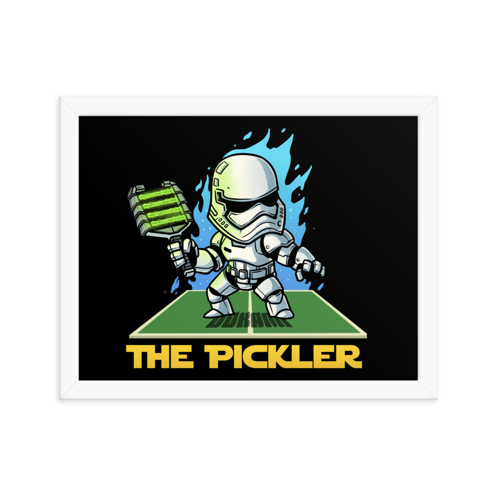  (11x14 inches): "Framed poster of 'The Pickler', featuring a stormtrooper-like figure in mid-action with a paddle, against a dark backdrop with blue flames, encased in a white frame.