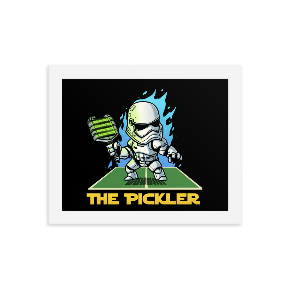  (8x8 inches): "Small square framed poster depicting 'The Pickler' in a stormtrooper-like outfit, aggressively wielding a pickleball paddle with blue flames, all set within a white frame.