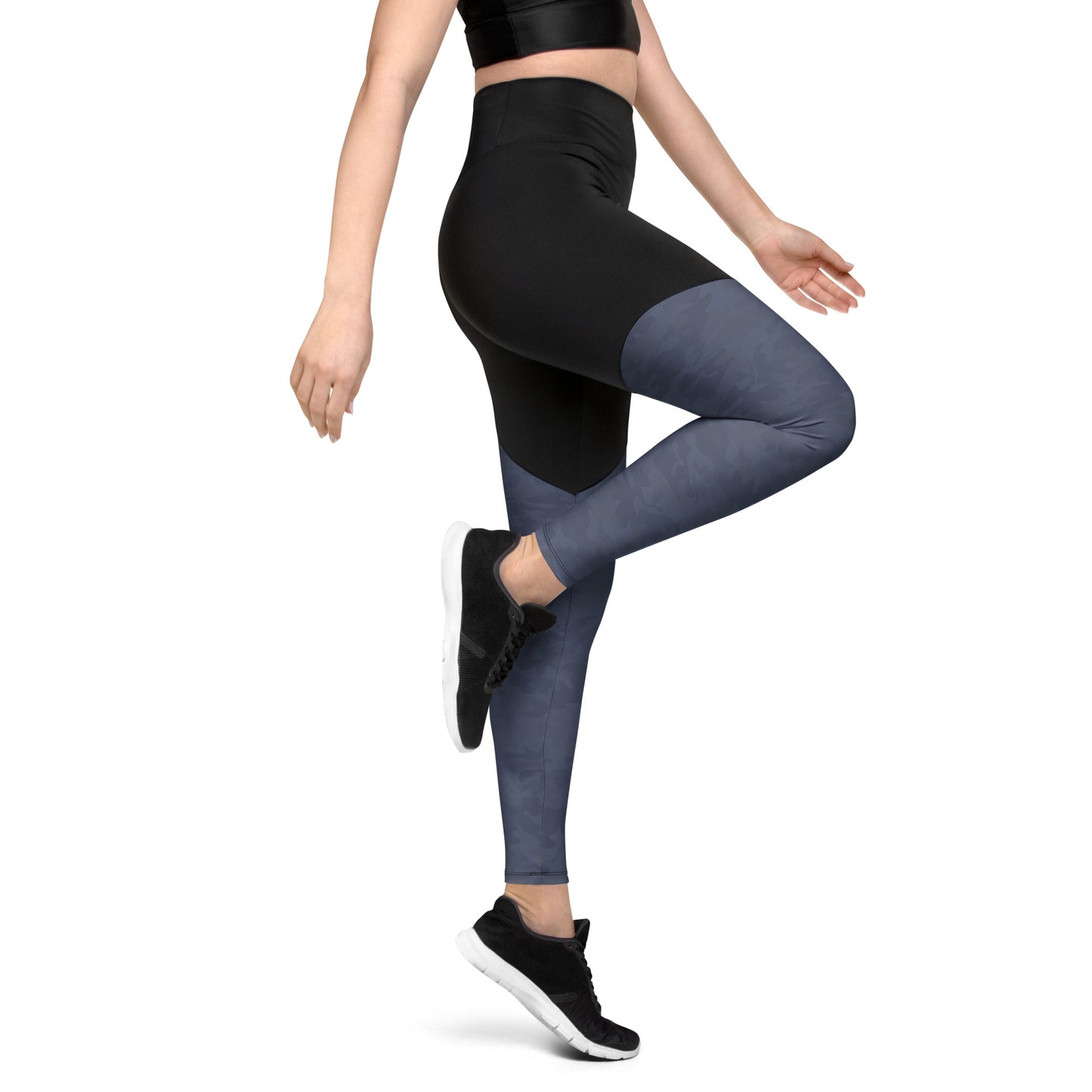 Side view of a woman wearing Urban Gray Camo Pickleball Sports Leggings, showcasing the high-waisted design and sleek urban gray camouflage print on the lower leg.