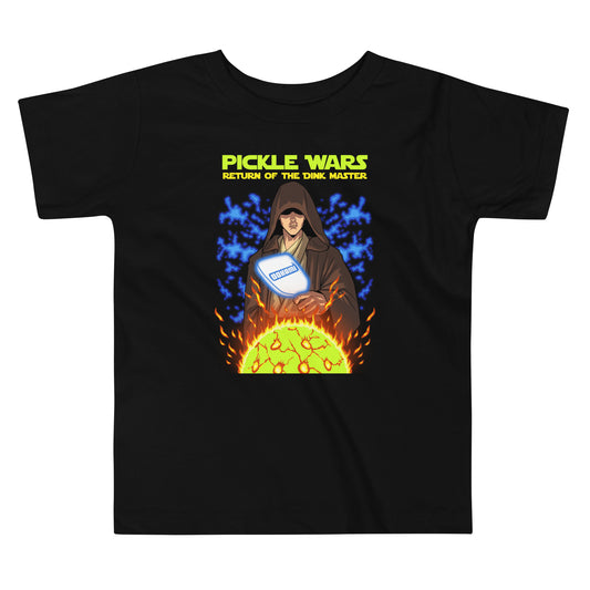 Front view of the black "Pickle Wars" toddler t-shirt featuring a Jedi holding a pickleball paddle with fiery and electric effects