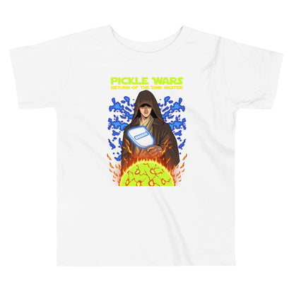 Front view of the white "Pickle Wars" toddler t-shirt featuring a Jedi holding a pickleball paddle with fiery and electric effects.