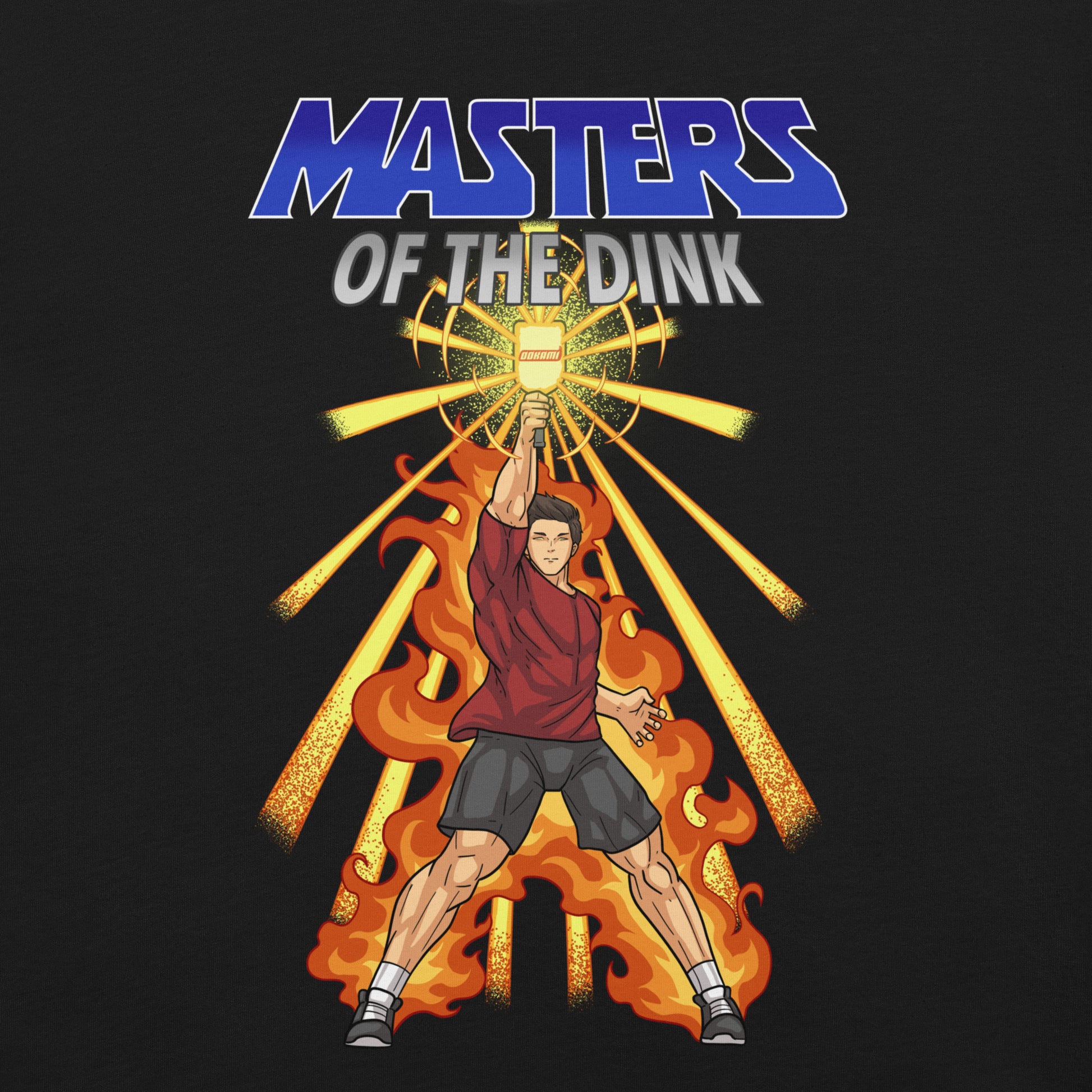 close up view of black t-shirt with Masters of the Dink design featuring a powerful figure holding a pickleball paddle amidst flames and radiant light.
