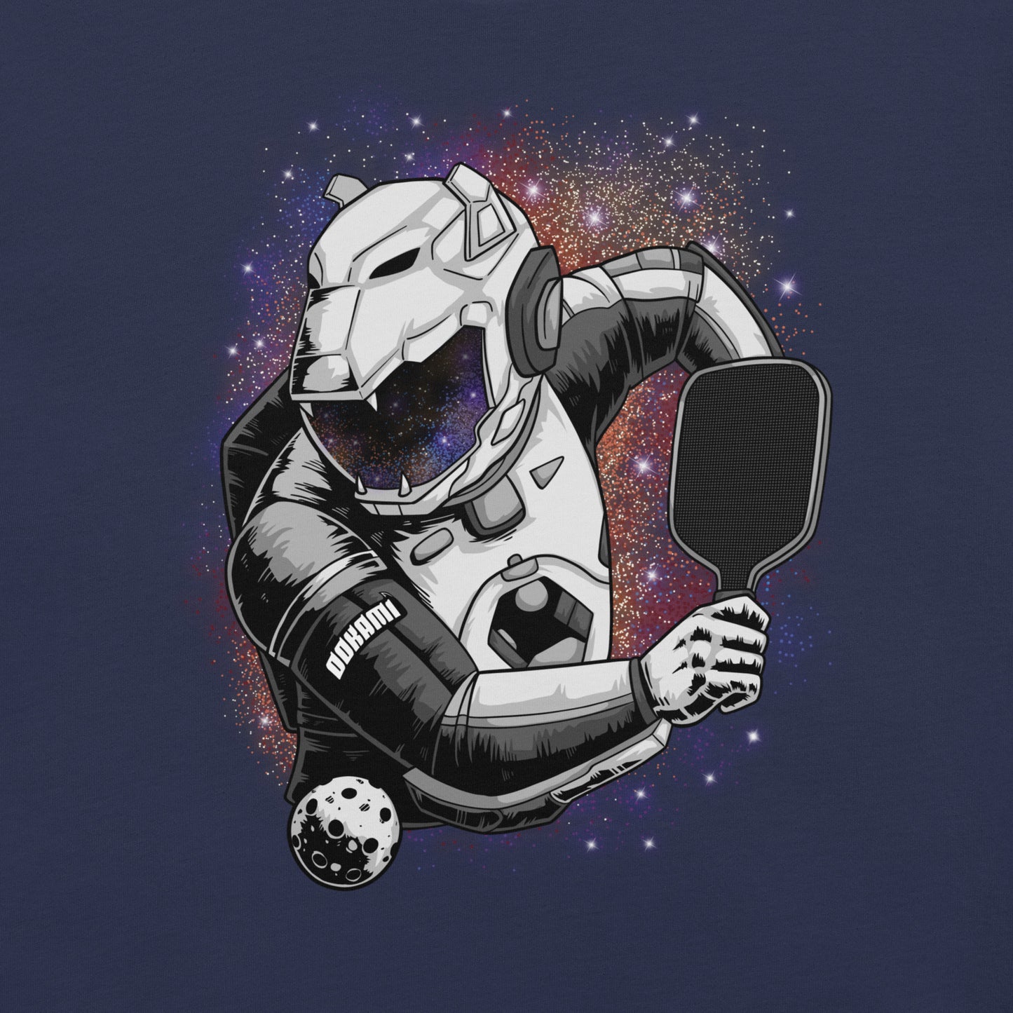 Close-up view of the astronaut playing pickleball graphic on the front of a navy t-shirt.