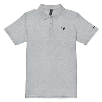 Front view of a sport grey women's pique polo shirt with a black embroidery badge depicting a pickleball paddle on the left chest and logo text on the right sleeve, crafted by OOKAMI SPORTS.