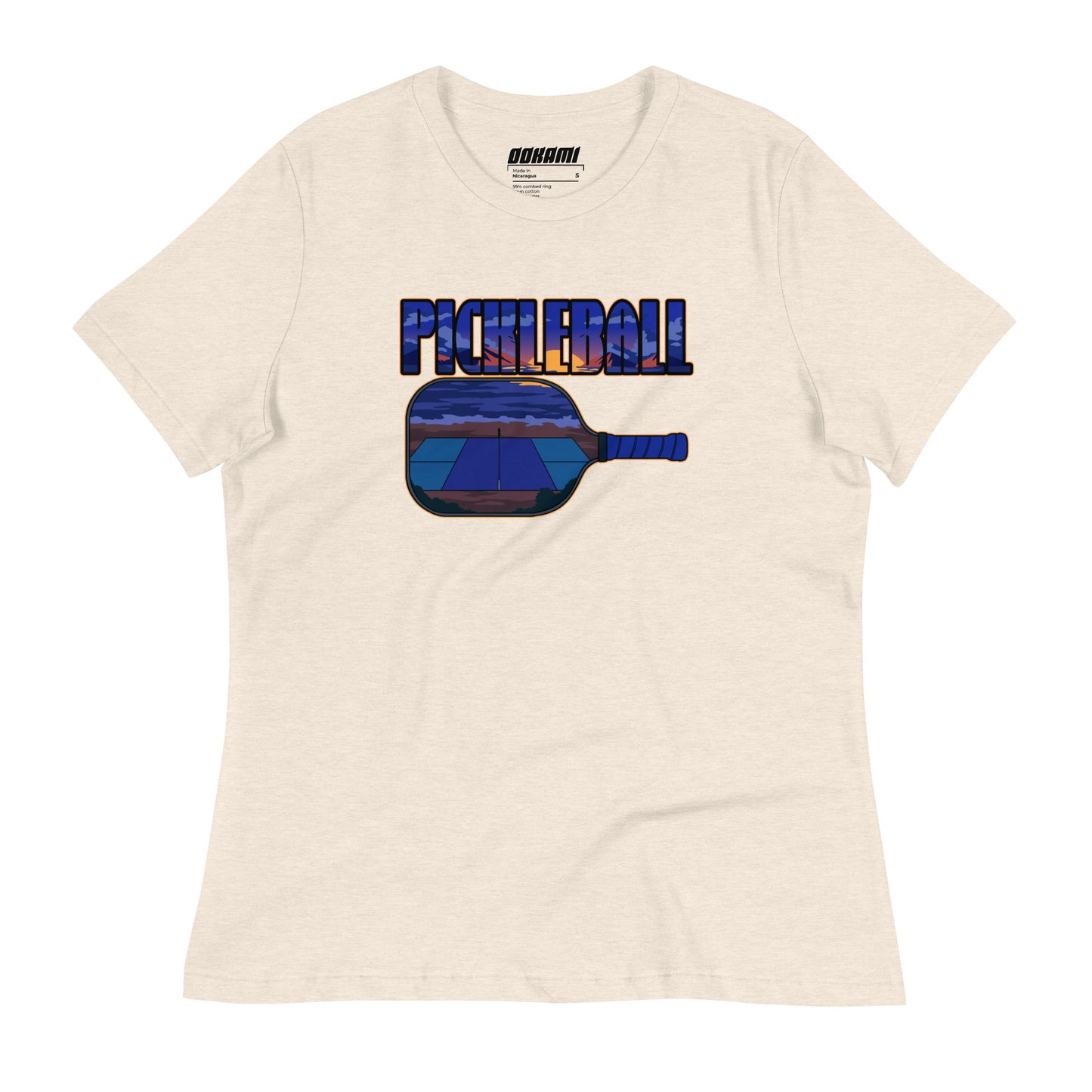 Front view of a heather prism natural Women's Relaxed T-Shirt with a Sunset Pickleball Paddle design.