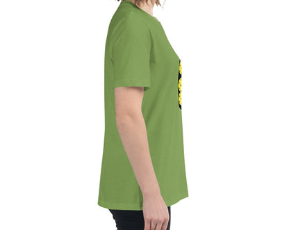 Side view of a woman wearing a leaf green T-shirt with a jar of pickleballs design.