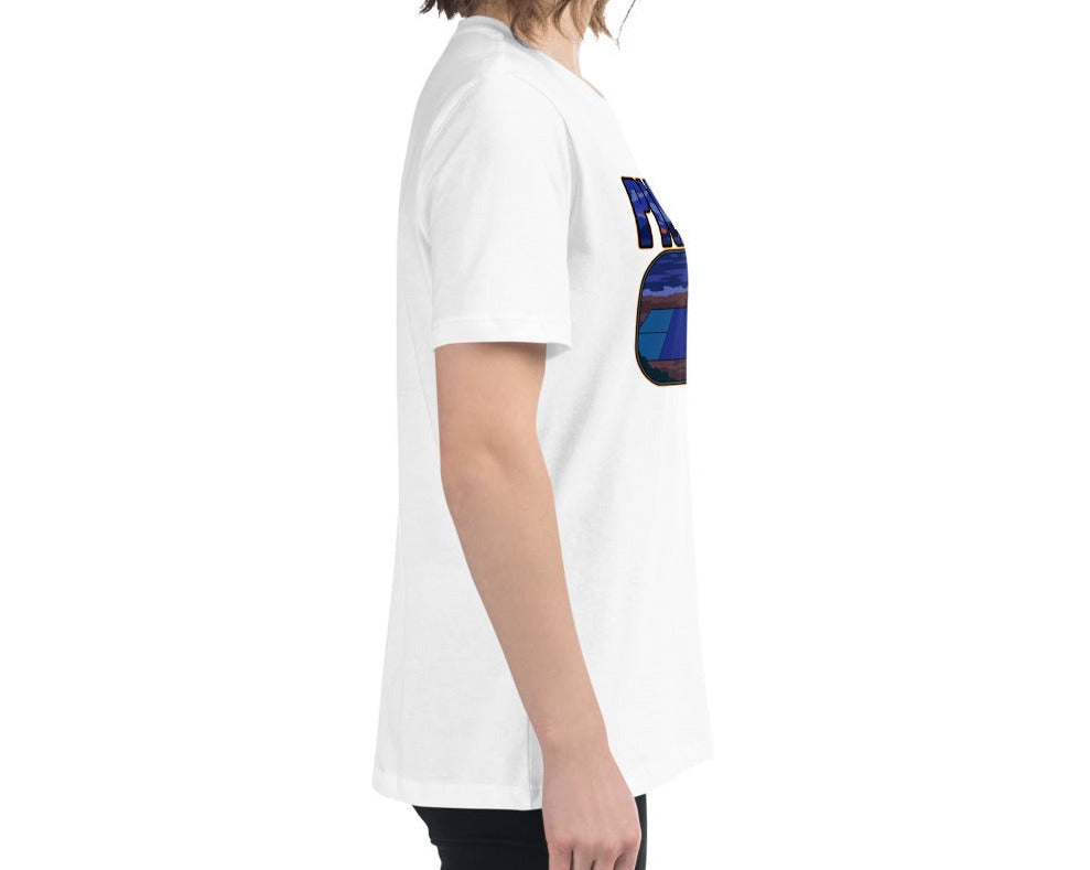 Side view of a woman wearing a white Women's Relaxed T-Shirt with a Sunset Pickleball Paddle design.