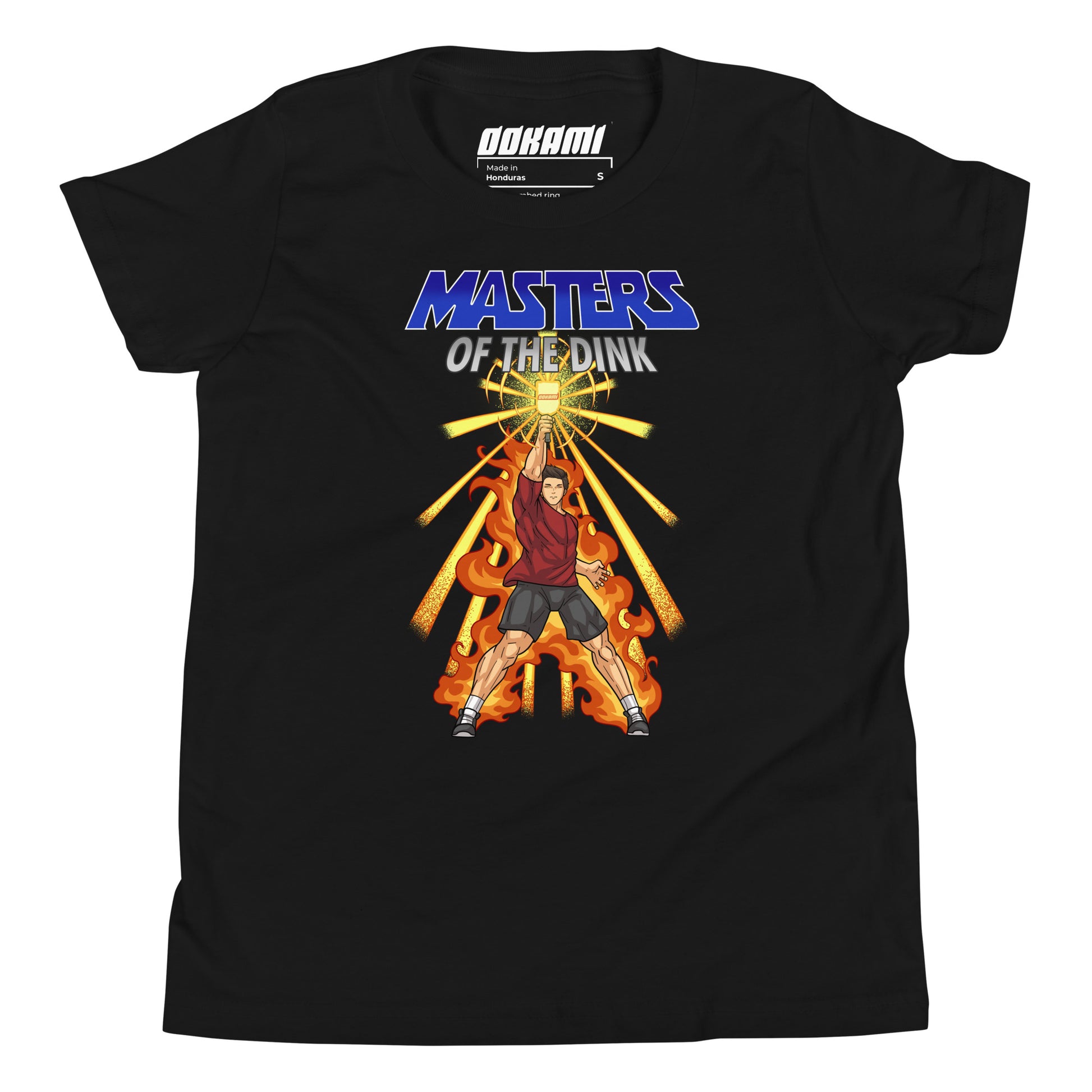 Youth size black t-shirt featuring a dynamic design inspired by He-Man and The Masters Of The Universe, showcasing a fierce pickleball player with a paddle, surrounded by flames and radiating energy